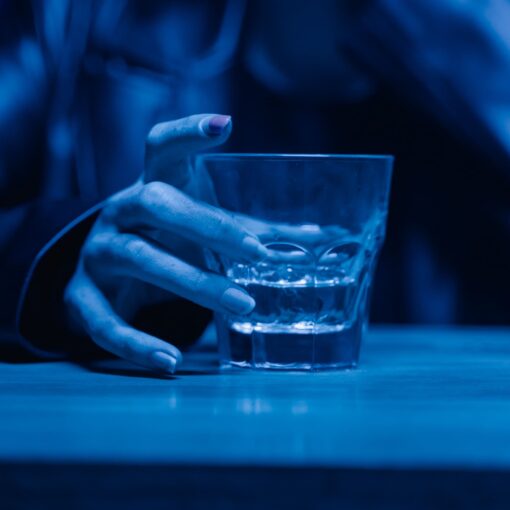 glass of alcohol, representing struggle with addiction
