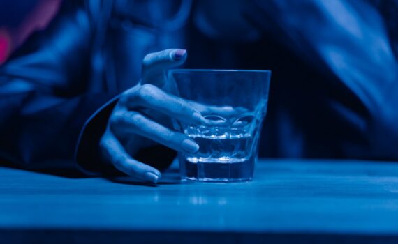 glass of alcohol, representing struggle with addiction