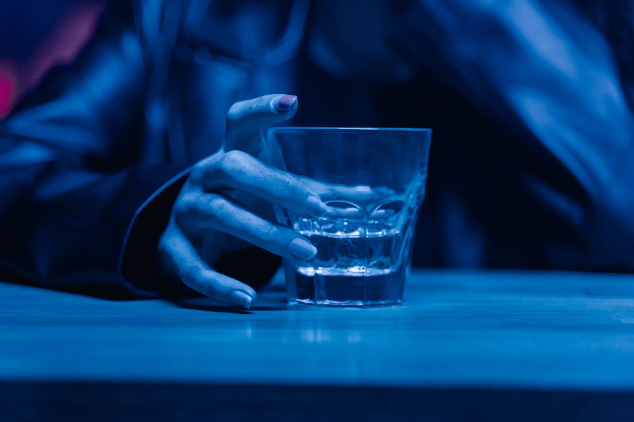 glass of alcohol, representing struggle with addiction